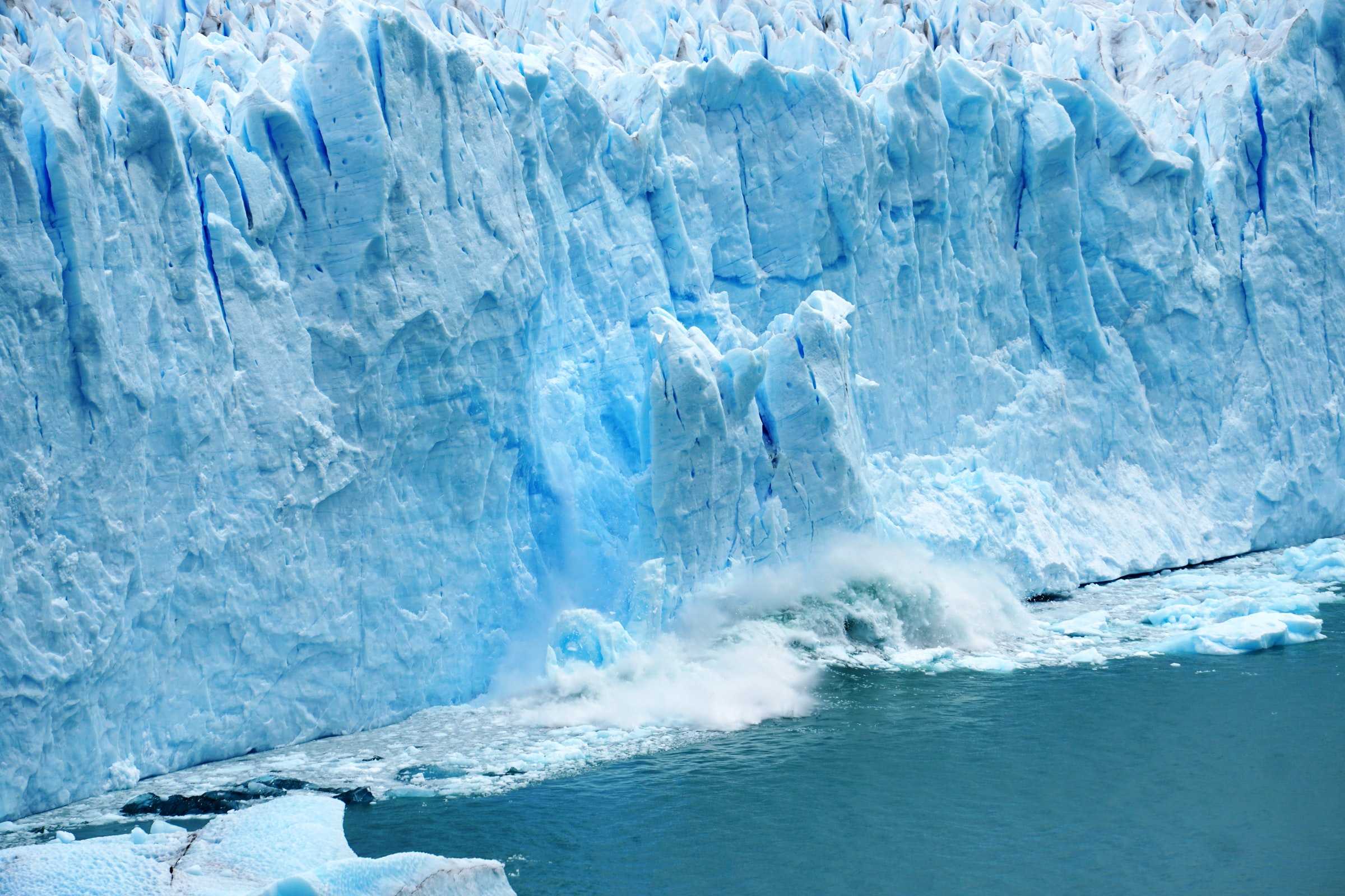 A glacier is a large mass of ice that moves slowly down a slope.